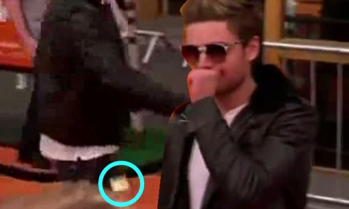 Zac Efron accidentally dropped a condom as went to take something out of his pocket when walking the red carpet at The Loraz premiere
