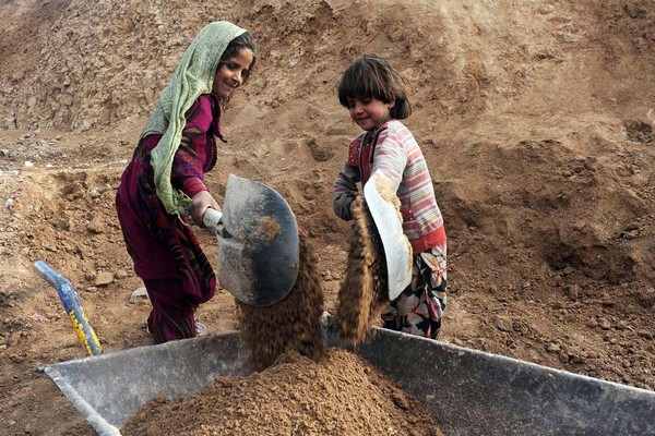 Afghan children work